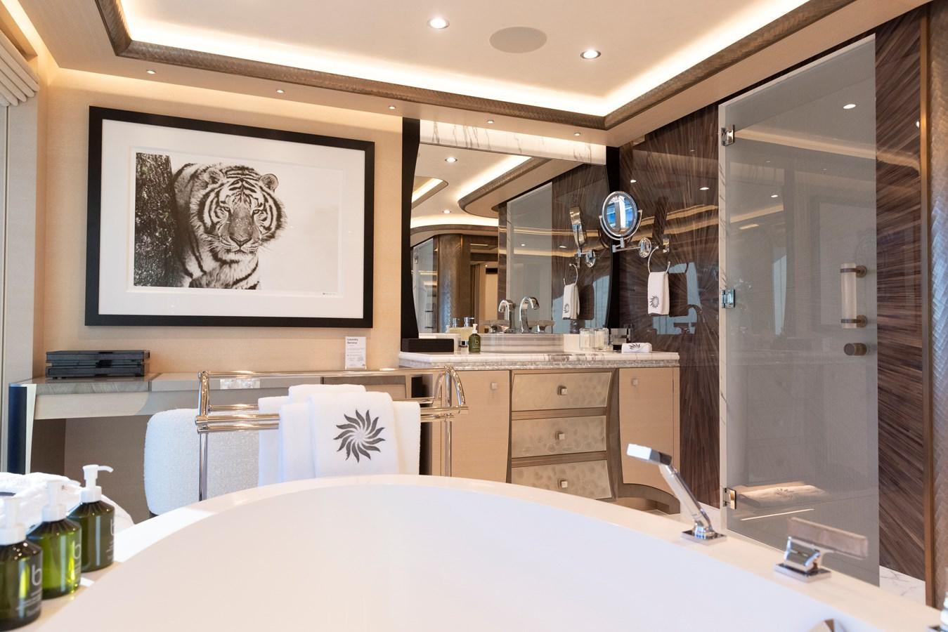 a bathroom with a large mirror aboard LUNA Yacht for Sale