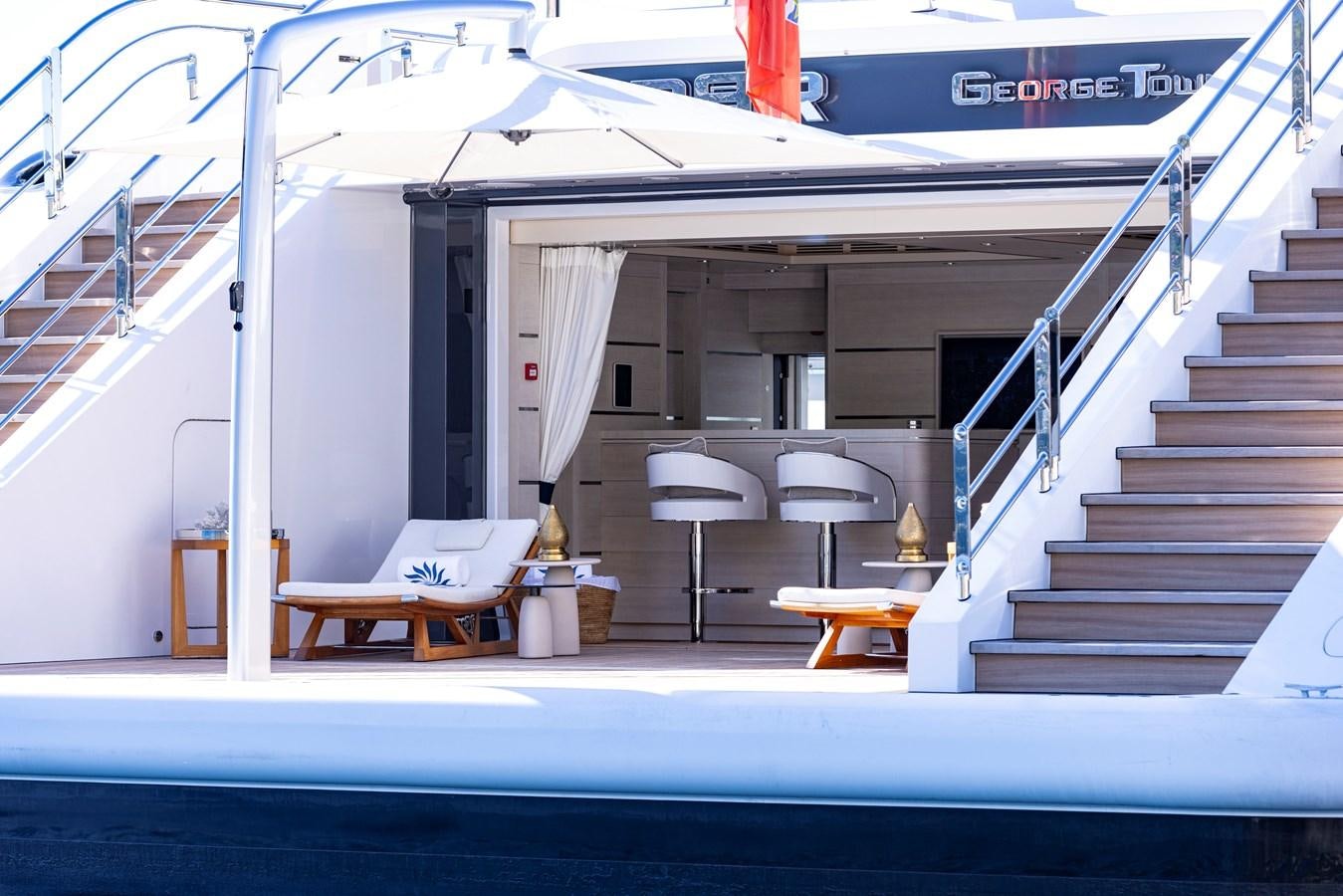 a boat with a bench and chairs aboard LUNA Yacht for Sale
