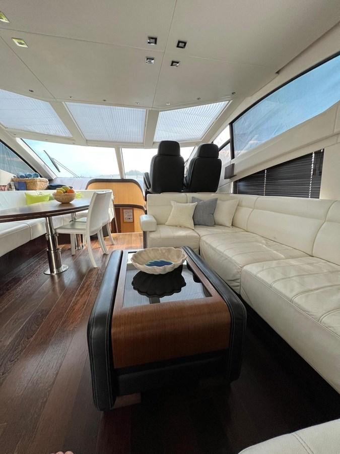 a room with a couch and a table aboard SUNSEEKER 75 YACHT Yacht for Sale