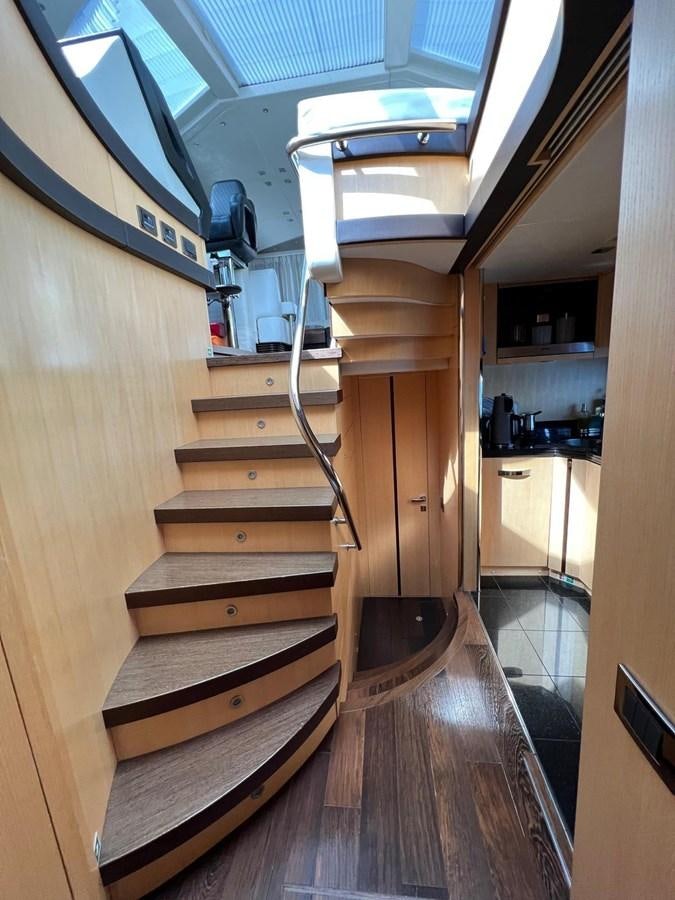 a wooden staircase in a house aboard SUNSEEKER 75 YACHT Yacht for Sale