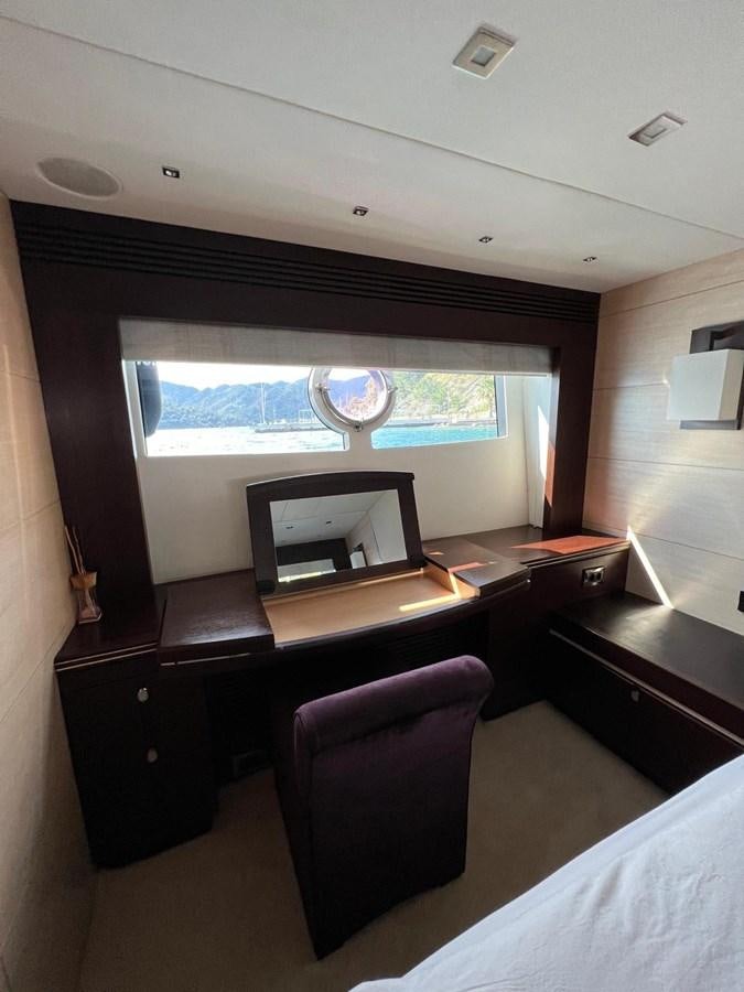 a room with a desk and a window aboard SUNSEEKER 75 YACHT Yacht for Sale