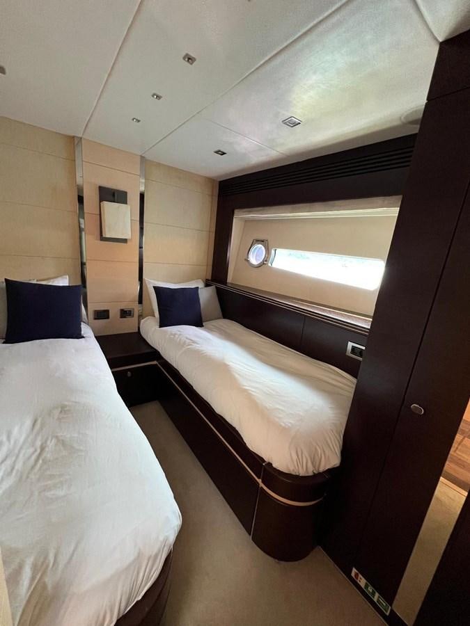 a room with two beds aboard SUNSEEKER 75 YACHT Yacht for Sale