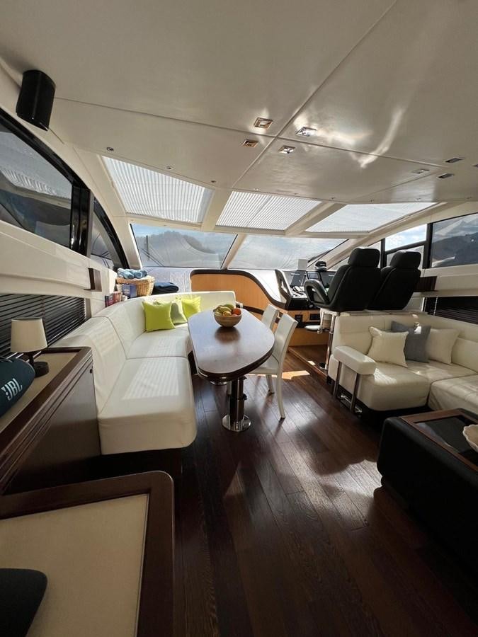 a room with a couch and a table aboard SUNSEEKER 75 YACHT Yacht for Sale