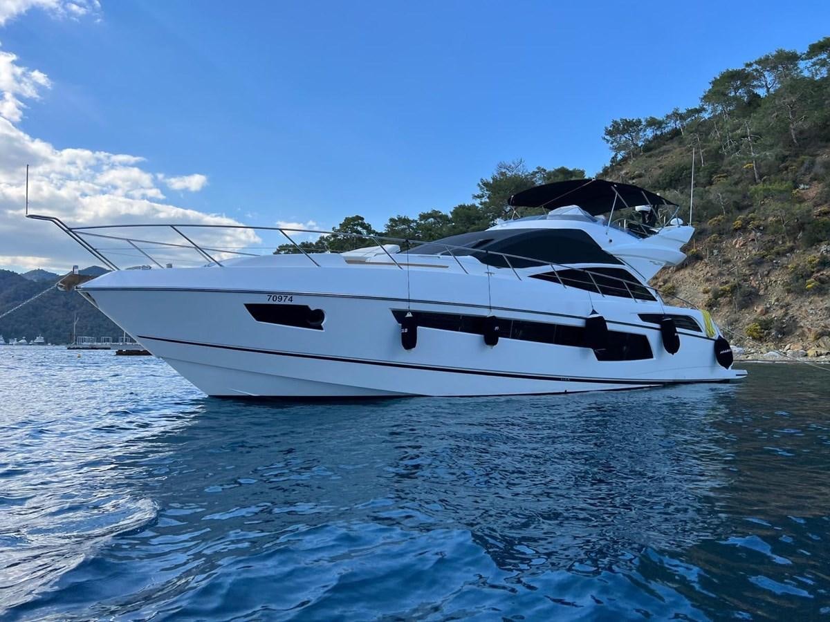 a white yacht on the water aboard SUNSEEKER 75 YACHT Yacht for Sale