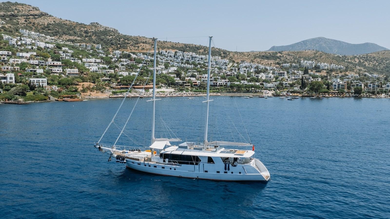 a boat on the water aboard CUSTOM MADE MOTORSAILER Yacht for Sale