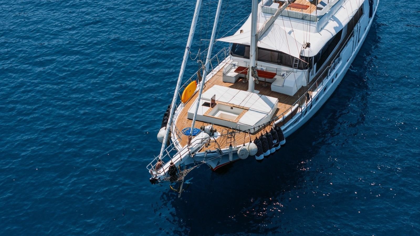 a boat in the water aboard CUSTOM MADE MOTORSAILER Yacht for Sale