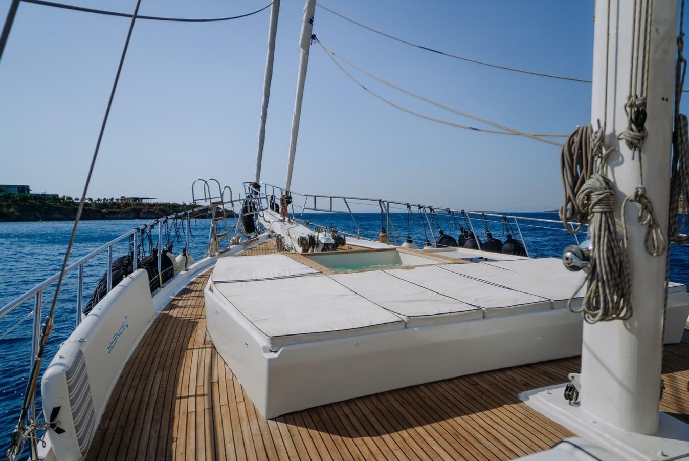 a boat on the water aboard CUSTOM MADE MOTORSAILER Yacht for Sale