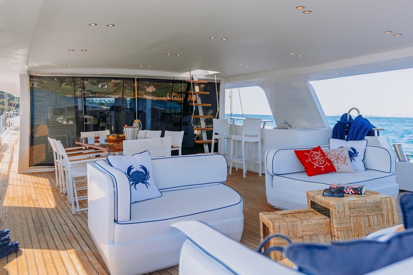 a living room with a large window aboard CUSTOM MADE MOTORSAILER Yacht for Sale