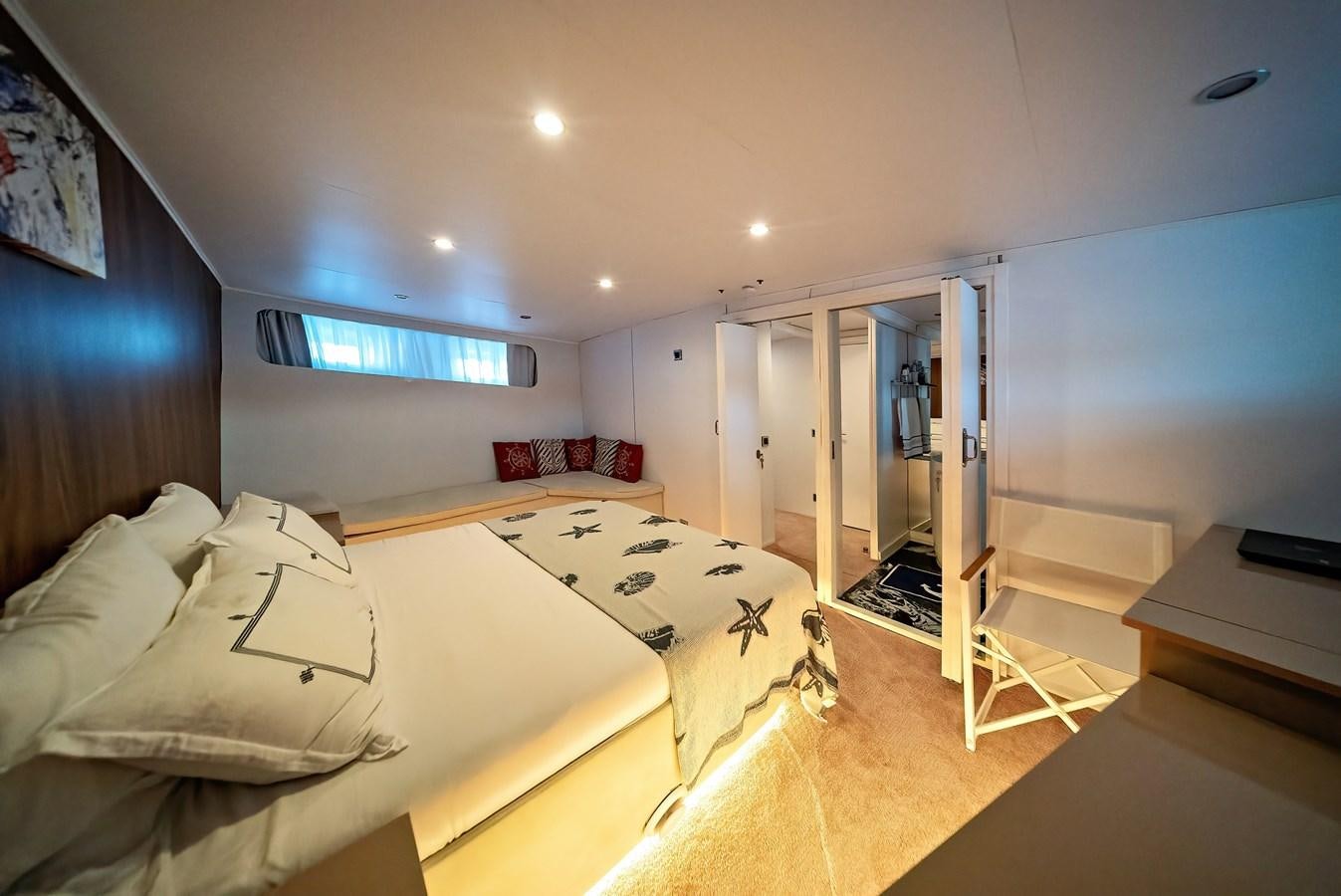 a bedroom with two beds aboard CUSTOM MADE MOTORSAILER Yacht for Sale