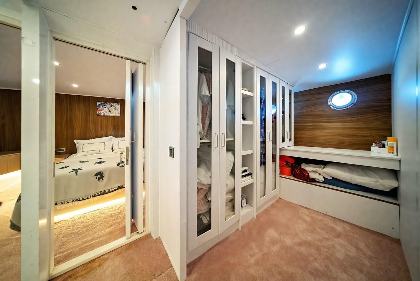 a room with a bed and a closet aboard CUSTOM MADE MOTORSAILER Yacht for Sale