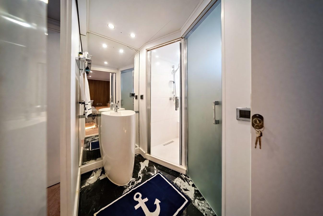 a bathroom with a urinal and a sink aboard CUSTOM MADE MOTORSAILER Yacht for Sale