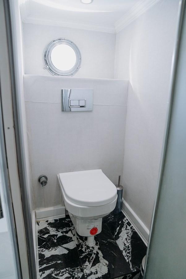 a toilet in a bathroom aboard CUSTOM MADE MOTORSAILER Yacht for Sale