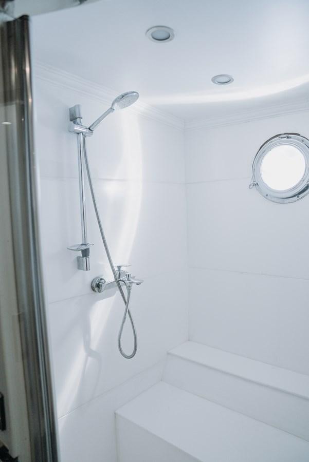 a shower with a glass door aboard CUSTOM MADE MOTORSAILER Yacht for Sale