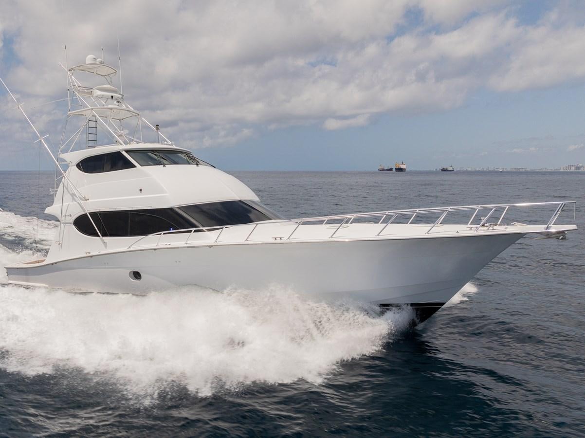 a white yacht splashing in the water aboard TEMPTATION Yacht for Sale