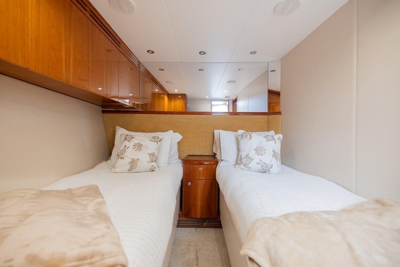 a room with two beds aboard TEMPTATION Yacht for Sale