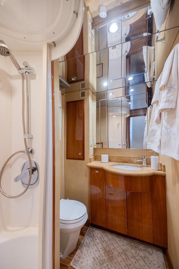 a bathroom with a sink and toilet aboard TEMPTATION Yacht for Sale