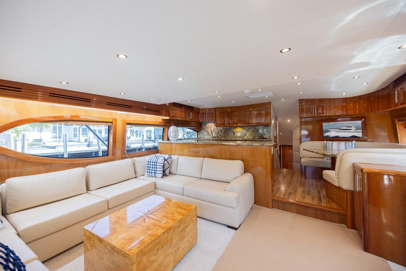 a living room with a large window aboard TEMPTATION Yacht for Sale