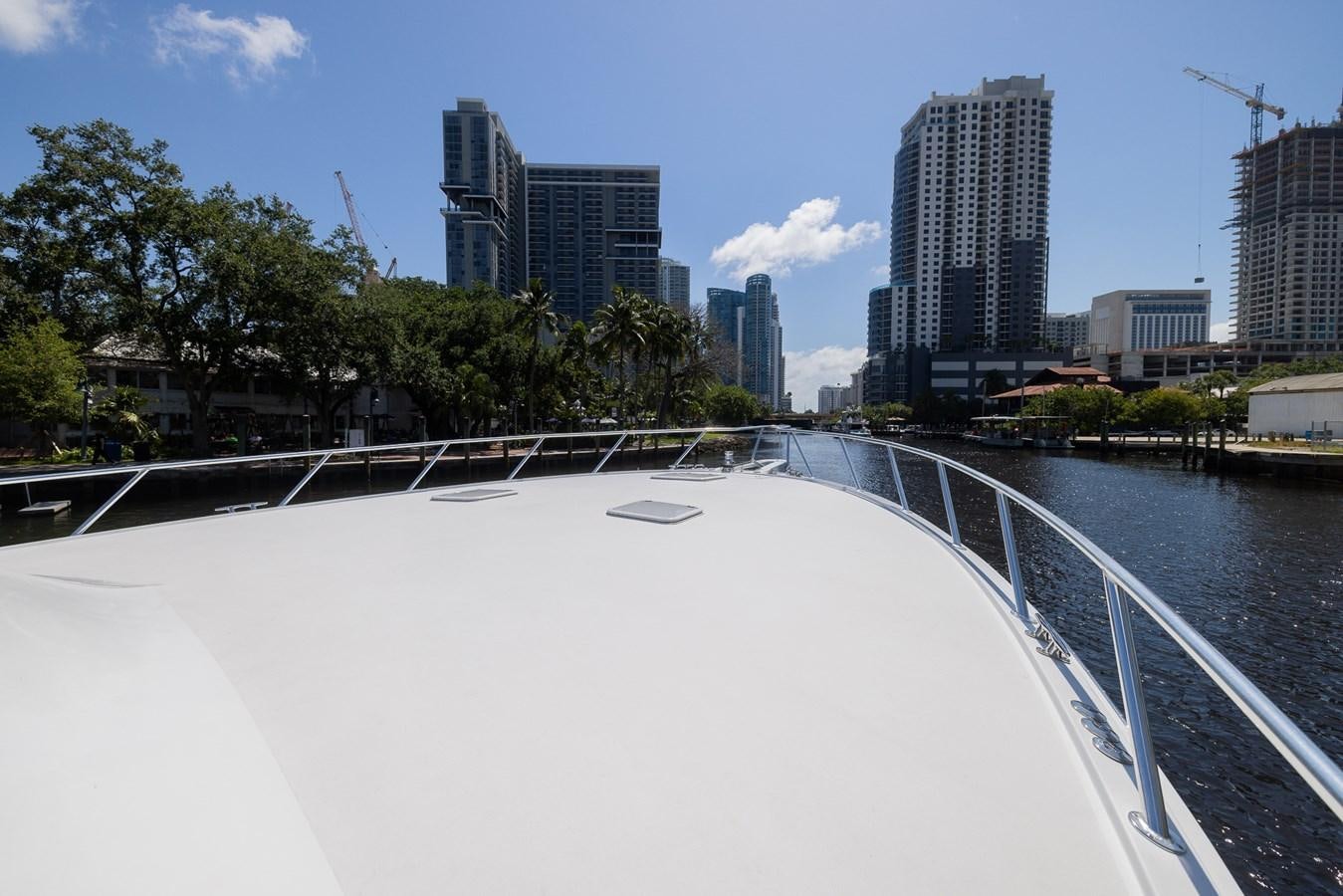 a large white pool in a city aboard TEMPTATION Yacht for Sale