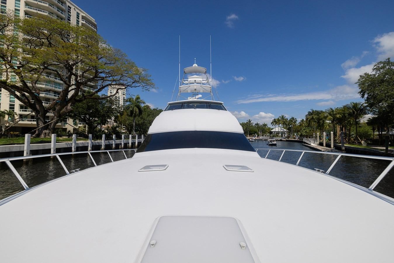 a white boat on a road aboard TEMPTATION Yacht for Sale