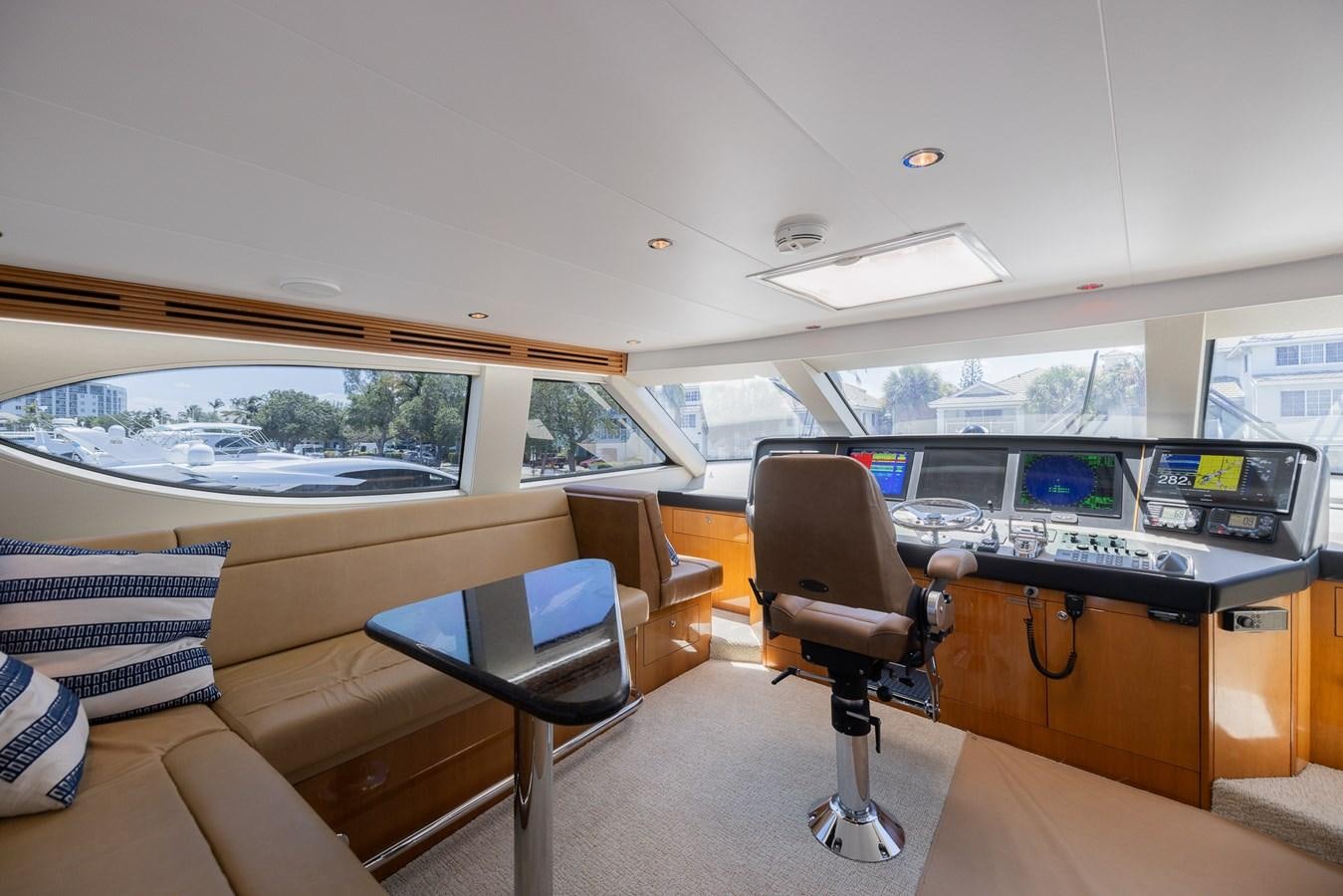 a room with a desk and chairs aboard TEMPTATION Yacht for Sale