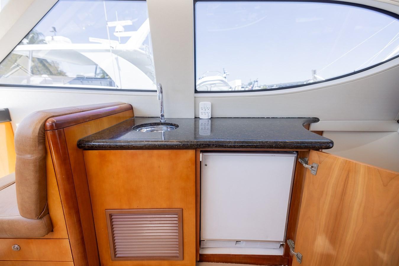 a black counter top on a wooden surface aboard TEMPTATION Yacht for Sale