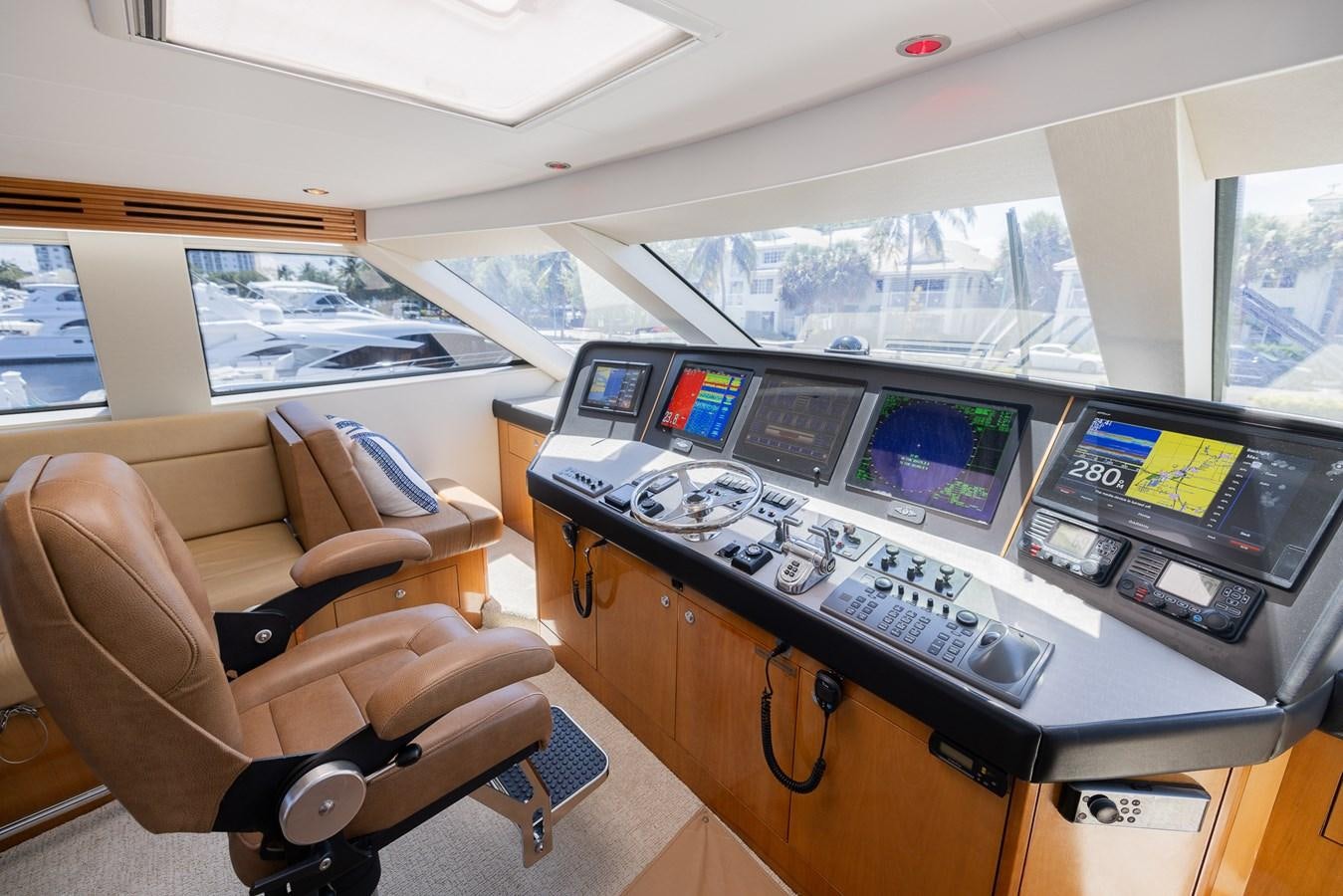 a room with many computers and monitors aboard TEMPTATION Yacht for Sale