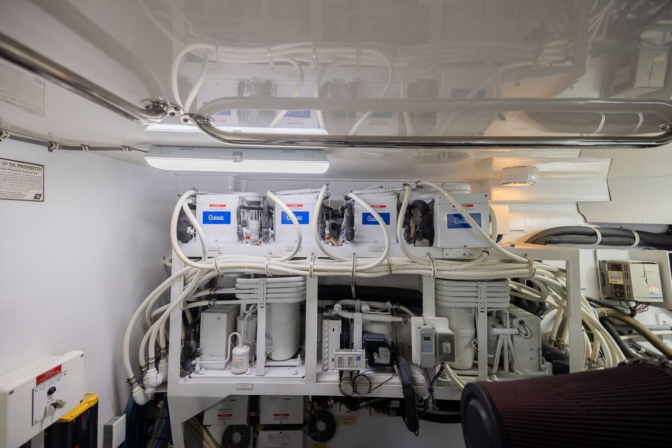 a large white machine with blue lights aboard TEMPTATION Yacht for Sale