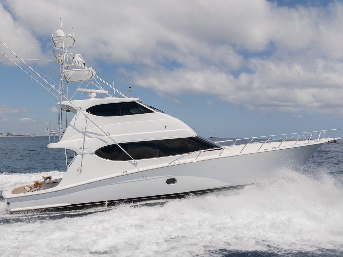 a white yacht on the water aboard TEMPTATION Yacht for Sale
