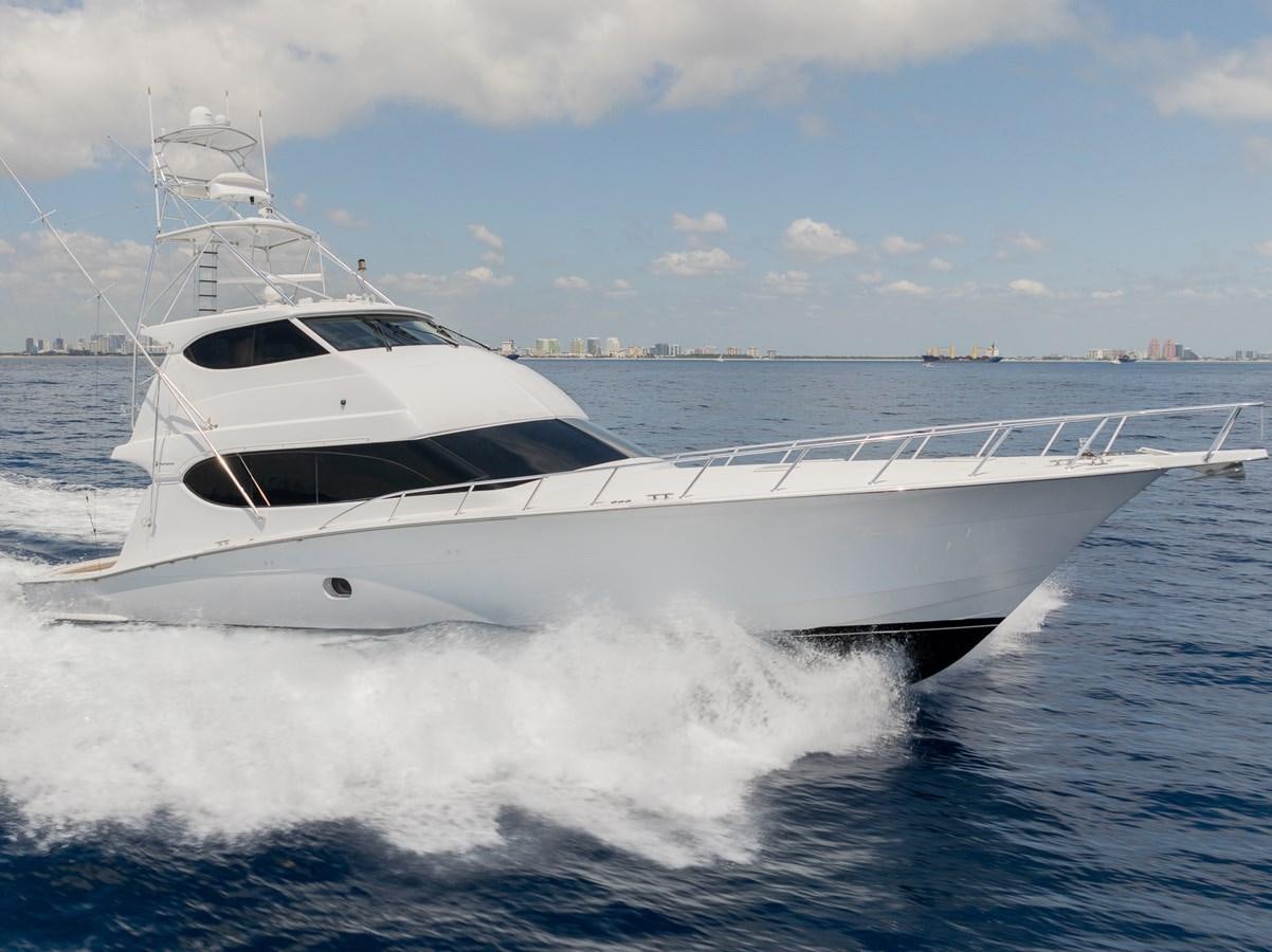 a white yacht on the water aboard TEMPTATION Yacht for Sale