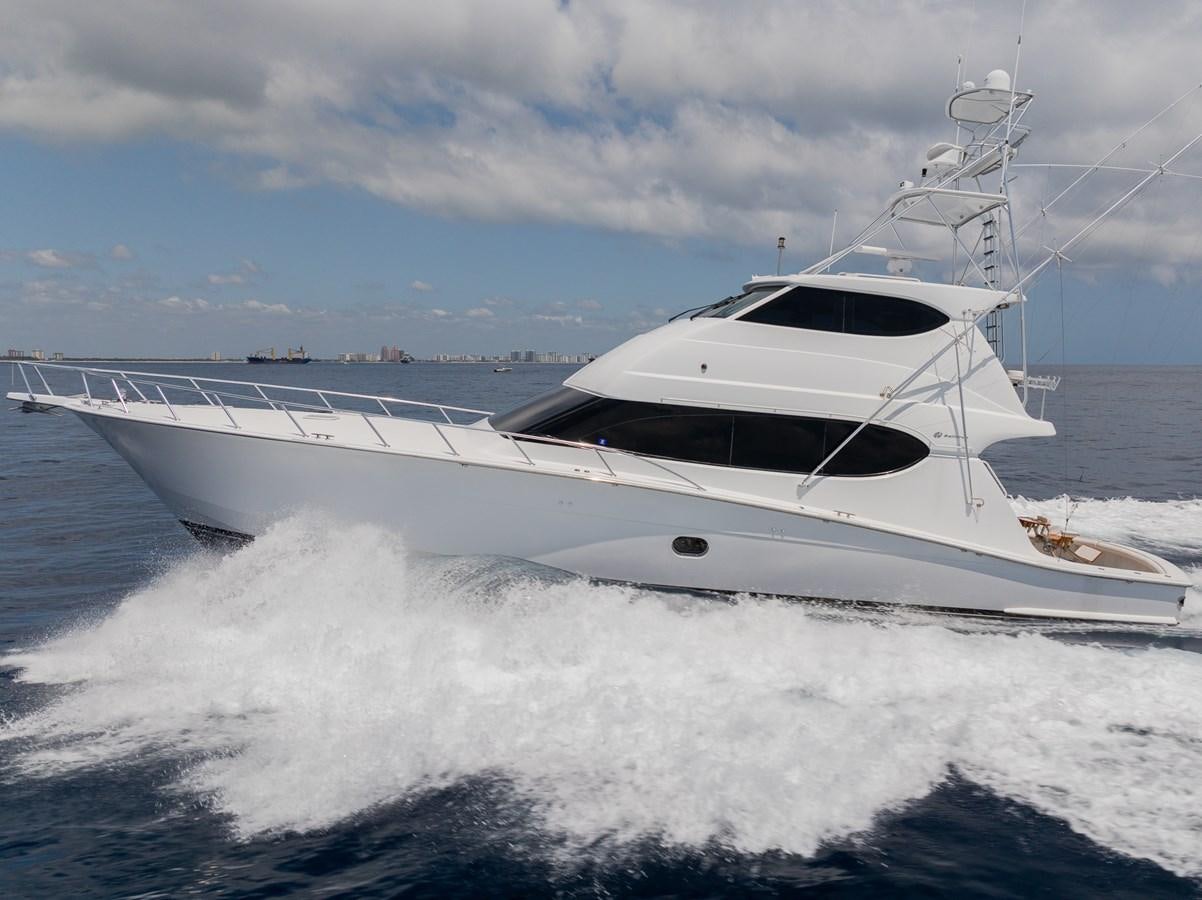 a white yacht on the water aboard TEMPTATION Yacht for Sale