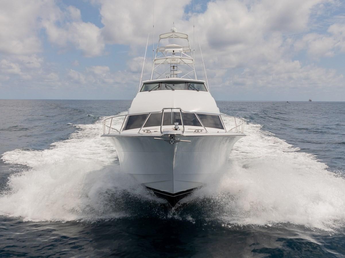 a white boat on the water aboard TEMPTATION Yacht for Sale