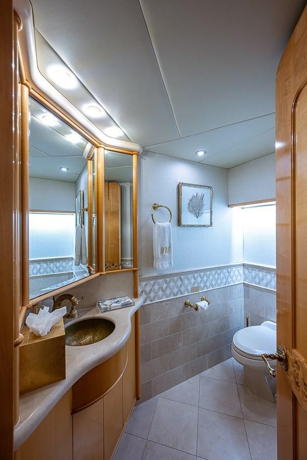 a bathroom with a sink and a mirror aboard WIRE WE HERE Yacht for Sale