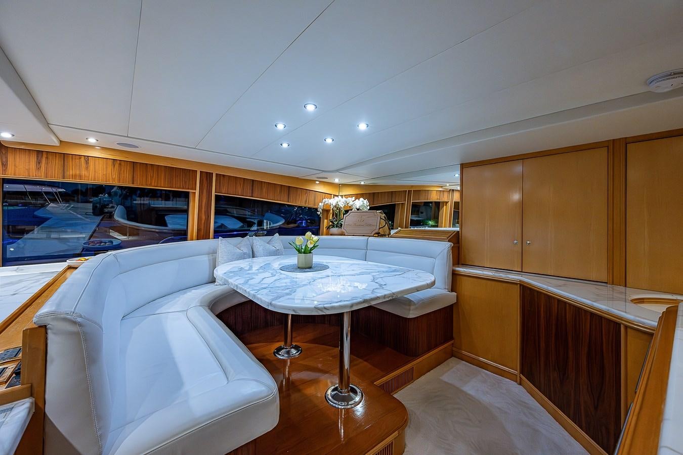 a room with a table and chairs aboard WIRE WE HERE Yacht for Sale