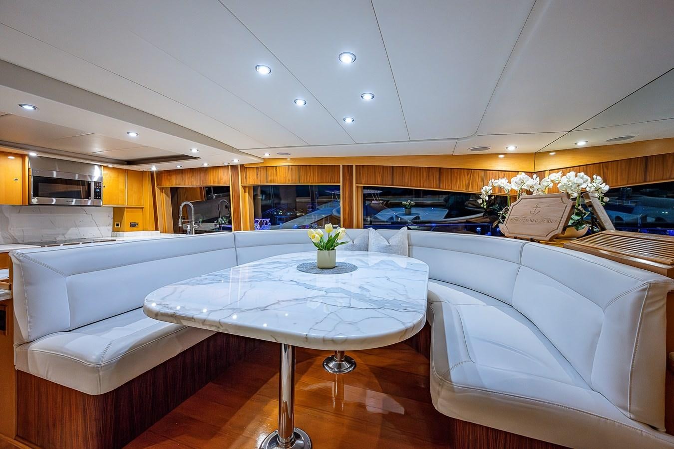 a room with a table and chairs aboard WIRE WE HERE Yacht for Sale