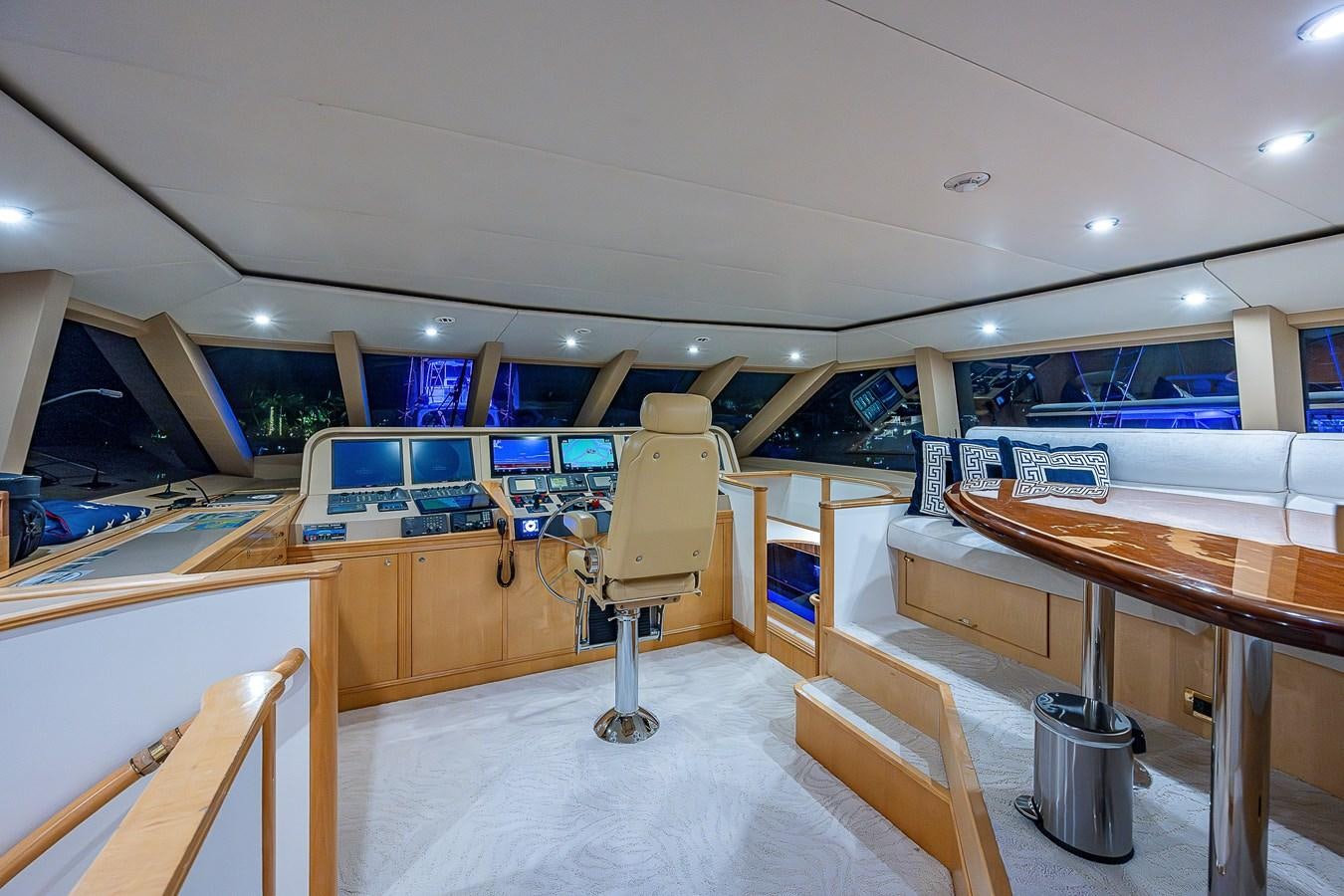 a room with tables and chairs aboard WIRE WE HERE Yacht for Sale
