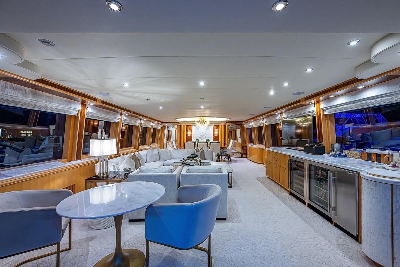 a large room with a table and chairs aboard WIRE WE HERE Yacht for Sale