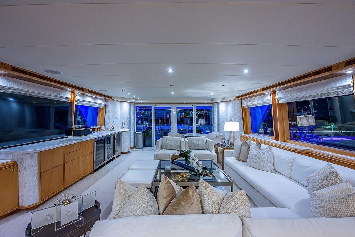 a living room with a large window aboard WIRE WE HERE Yacht for Sale