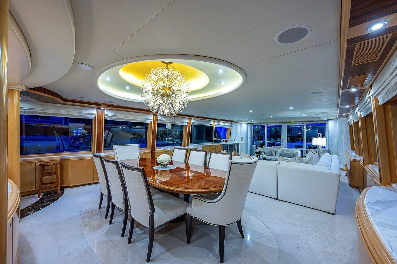 a room with tables and chairs aboard WIRE WE HERE Yacht for Sale