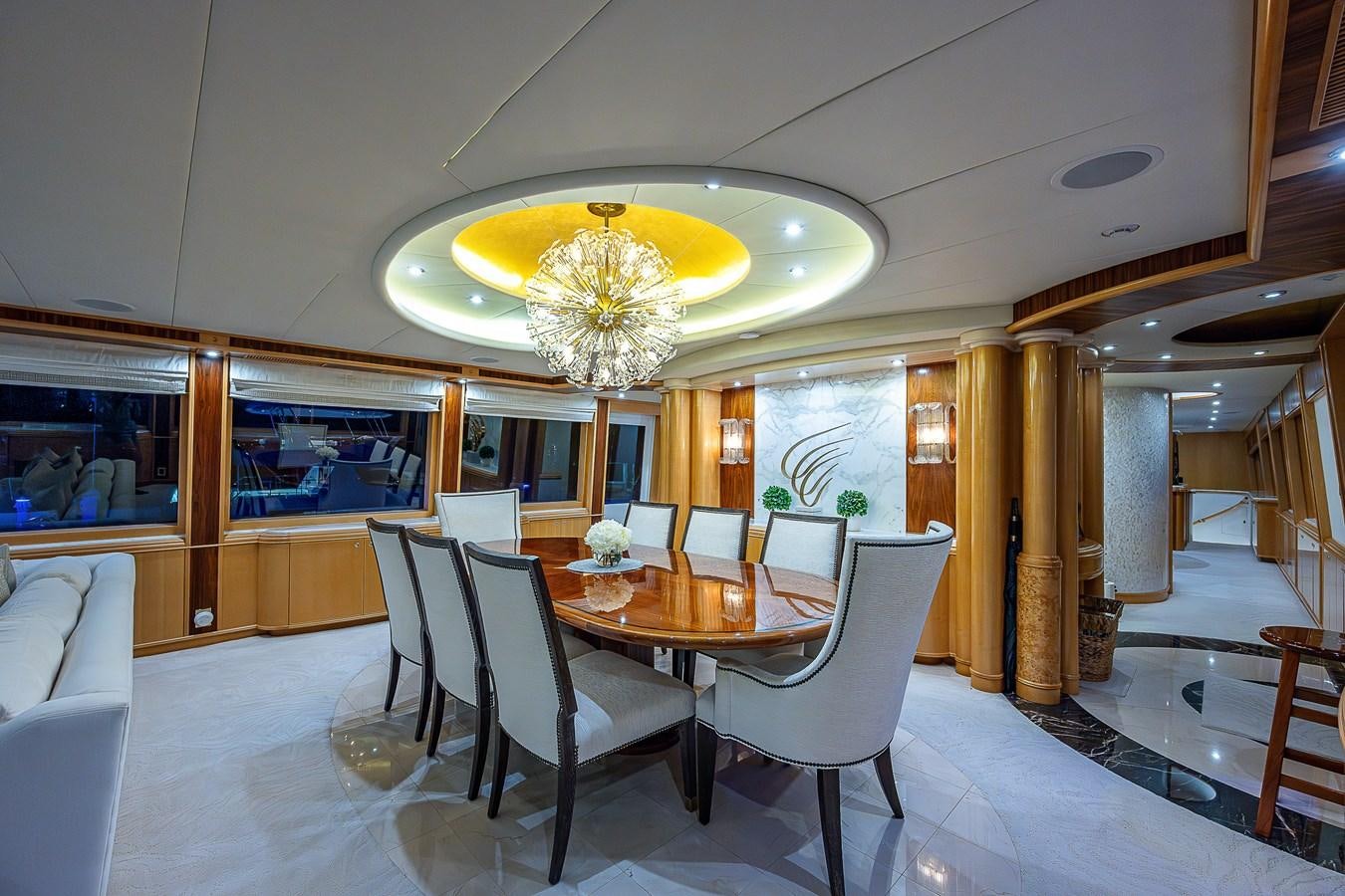 a large room with a table and chairs aboard WIRE WE HERE Yacht for Sale