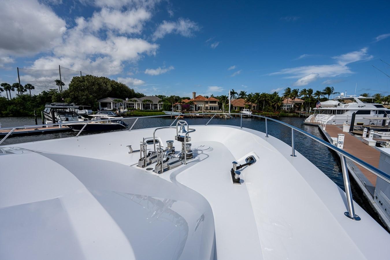 a large white boat with a blue sky above it aboard WIRE WE HERE Yacht for Sale