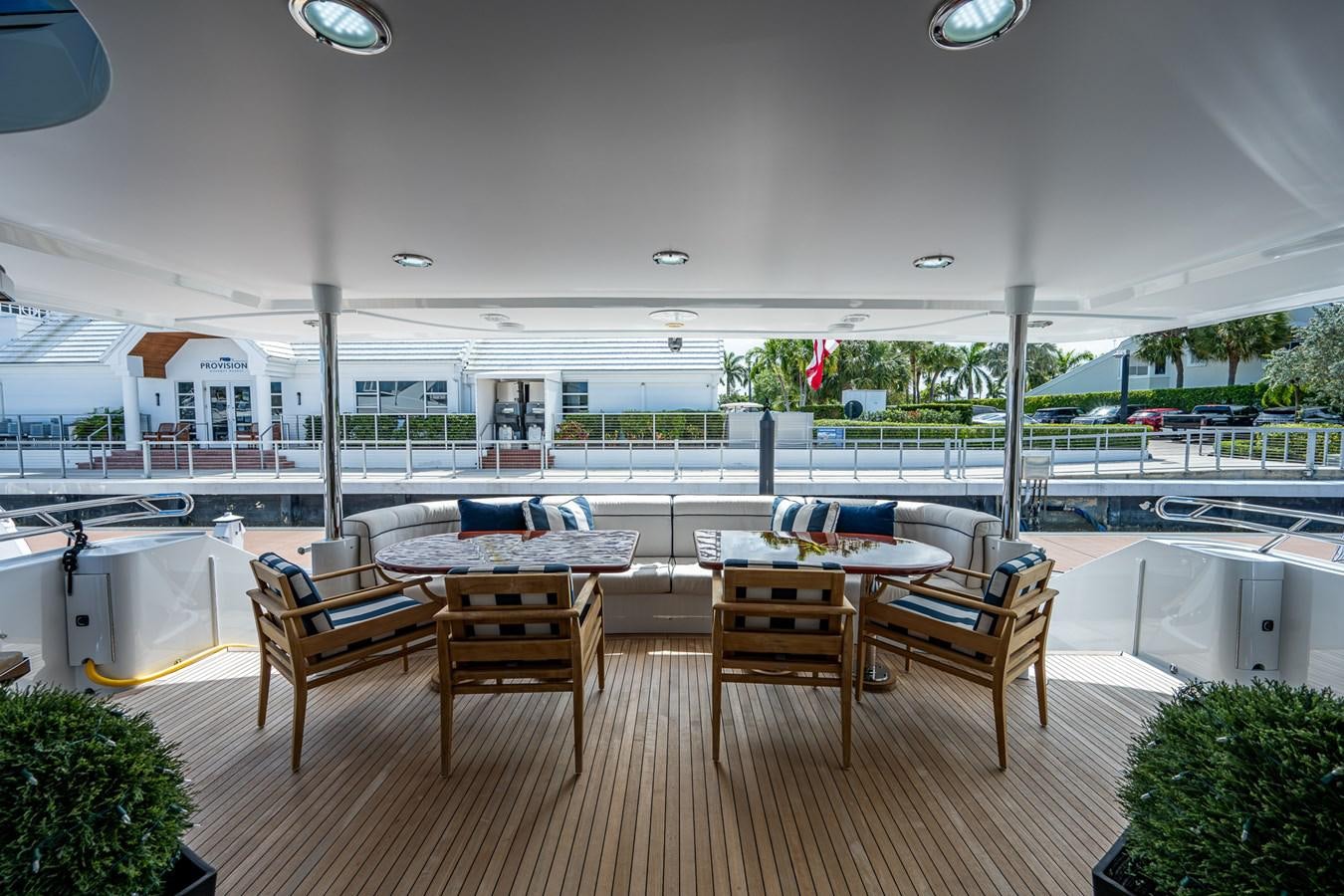 a room with tables and chairs aboard WIRE WE HERE Yacht for Sale