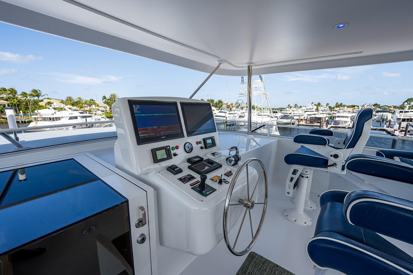 a boat with a screen and a steering wheel on the front aboard WIRE WE HERE Yacht for Sale