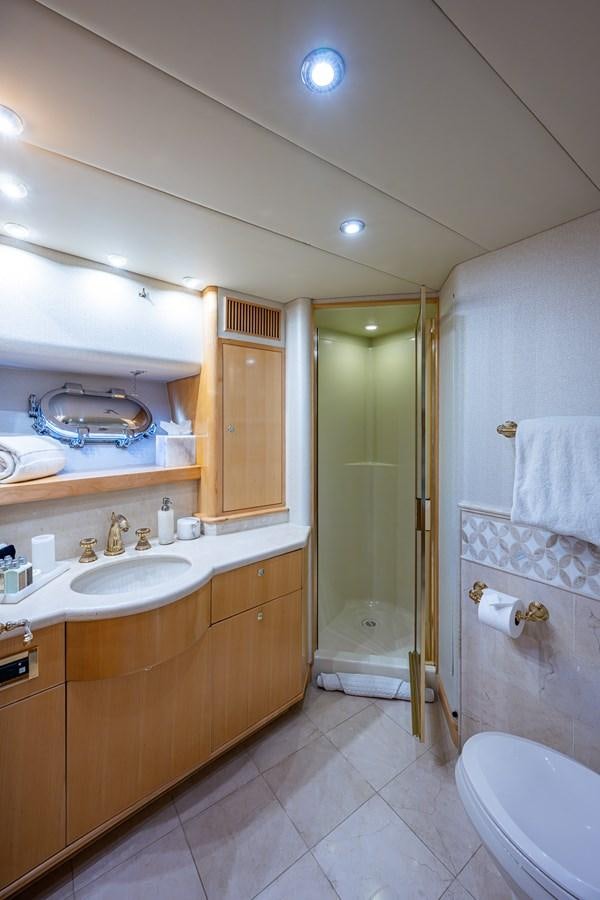 a bathroom with a shower and sink aboard WIRE WE HERE Yacht for Sale