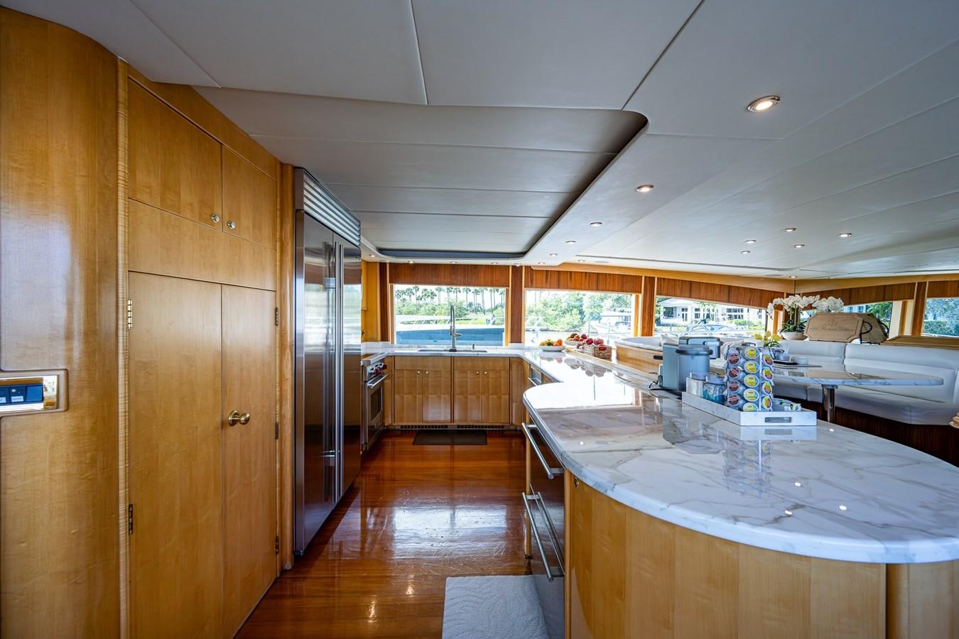 a large room with a table and chairs aboard WIRE WE HERE Yacht for Sale