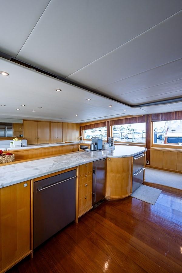 a kitchen with a large island aboard WIRE WE HERE Yacht for Sale