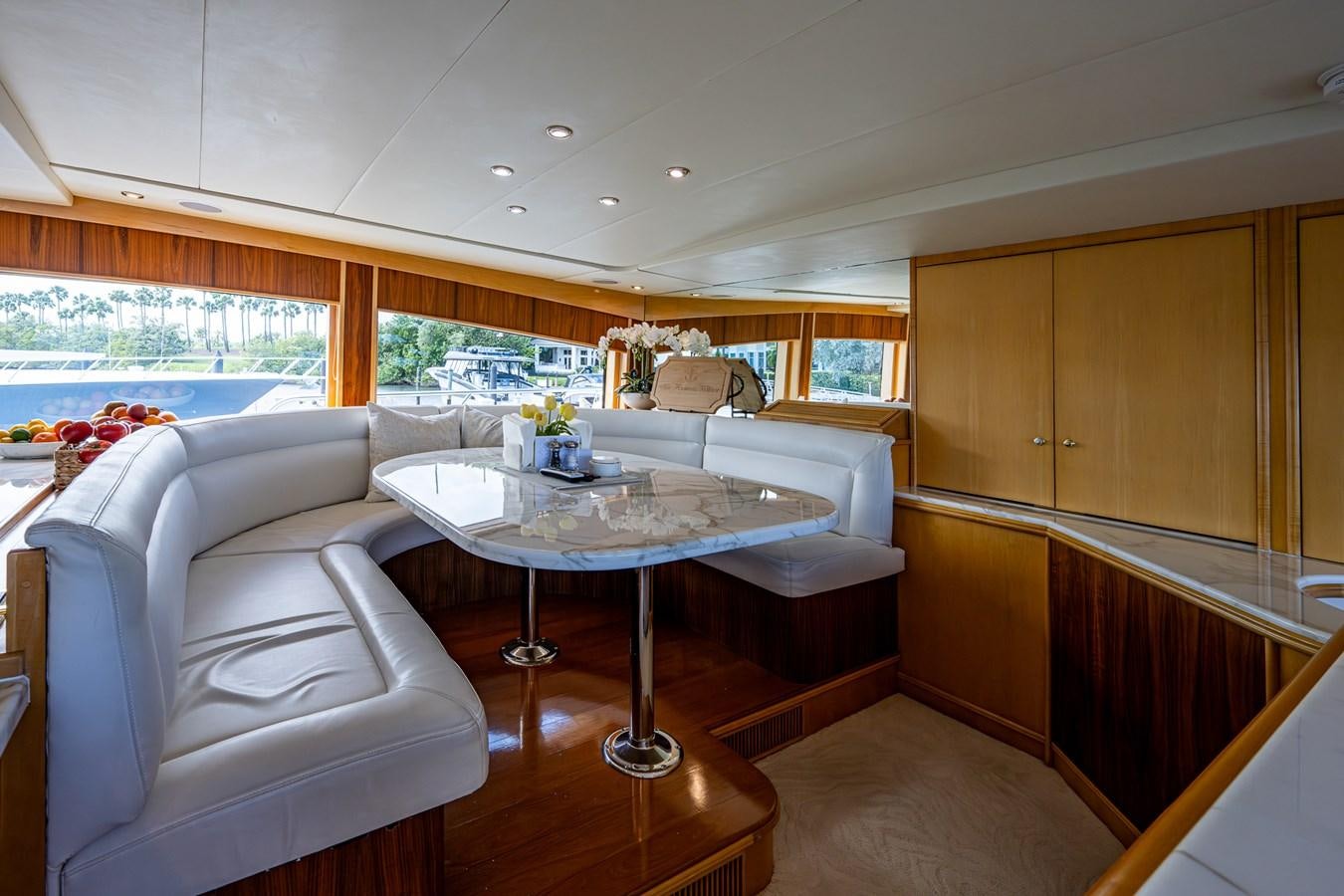 a living room with a couch and a table aboard WIRE WE HERE Yacht for Sale