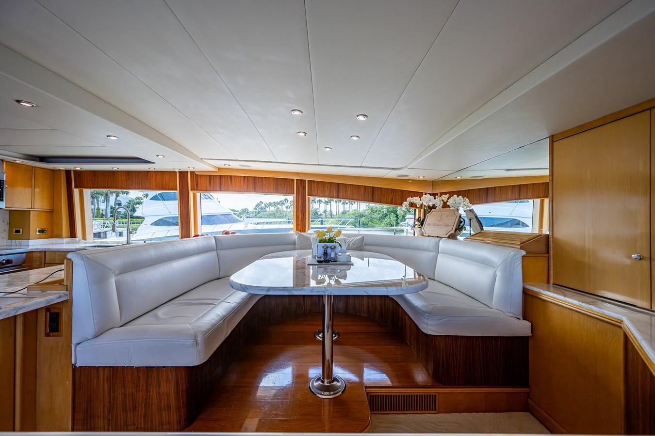 a living room with a couch and a table aboard WIRE WE HERE Yacht for Sale