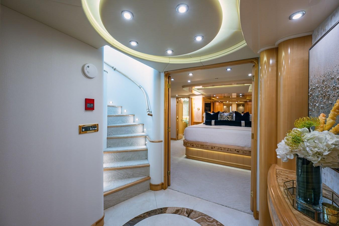 a hallway with a bed and a staircase aboard WIRE WE HERE Yacht for Sale