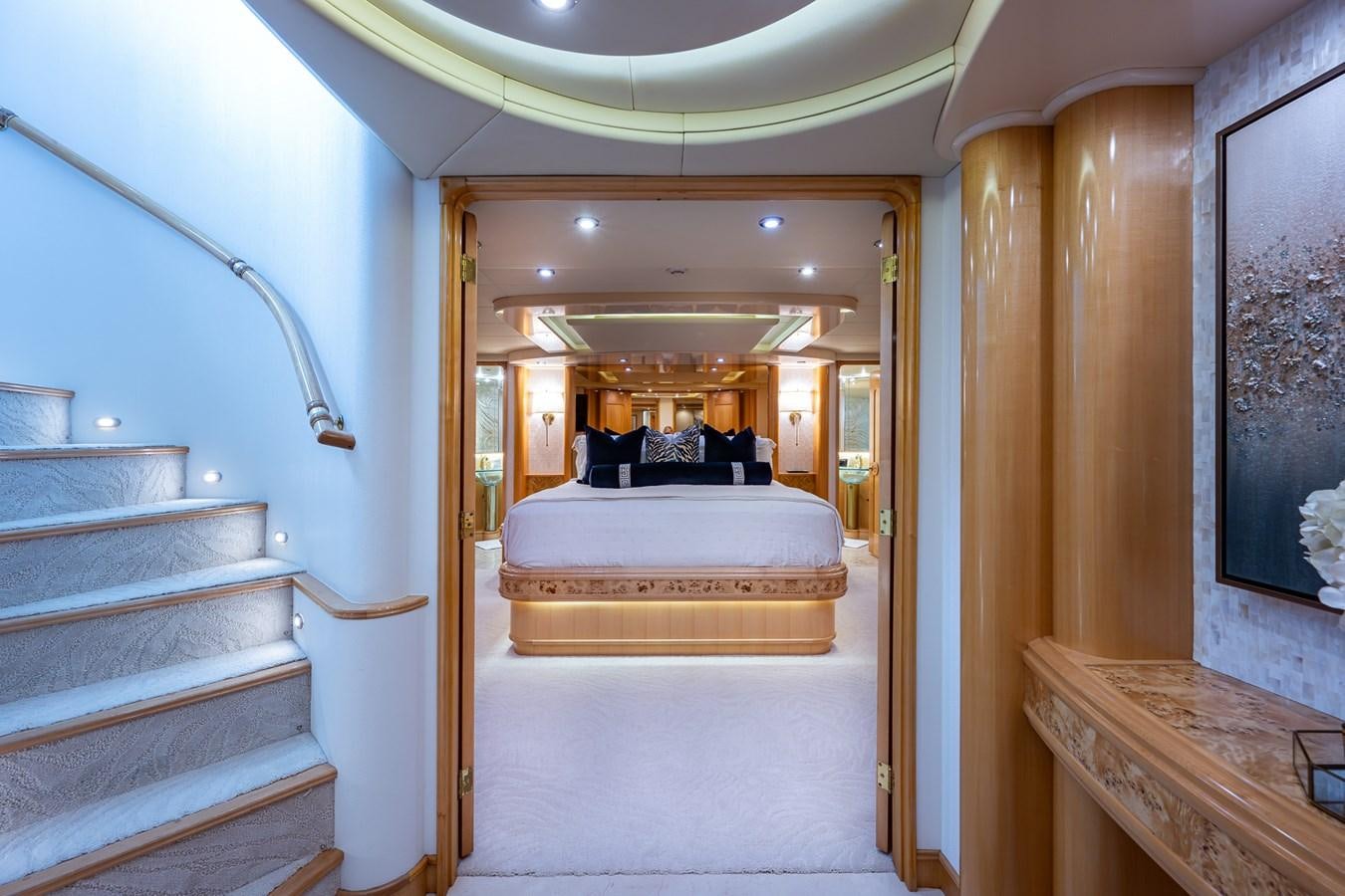 a room with a bed and a staircase aboard WIRE WE HERE Yacht for Sale