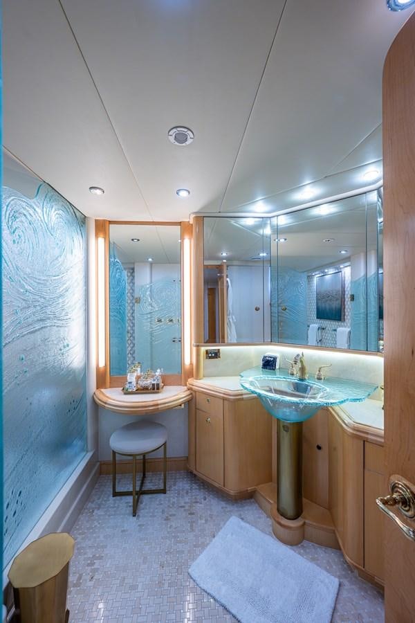 a bathroom with a large mirror aboard WIRE WE HERE Yacht for Sale